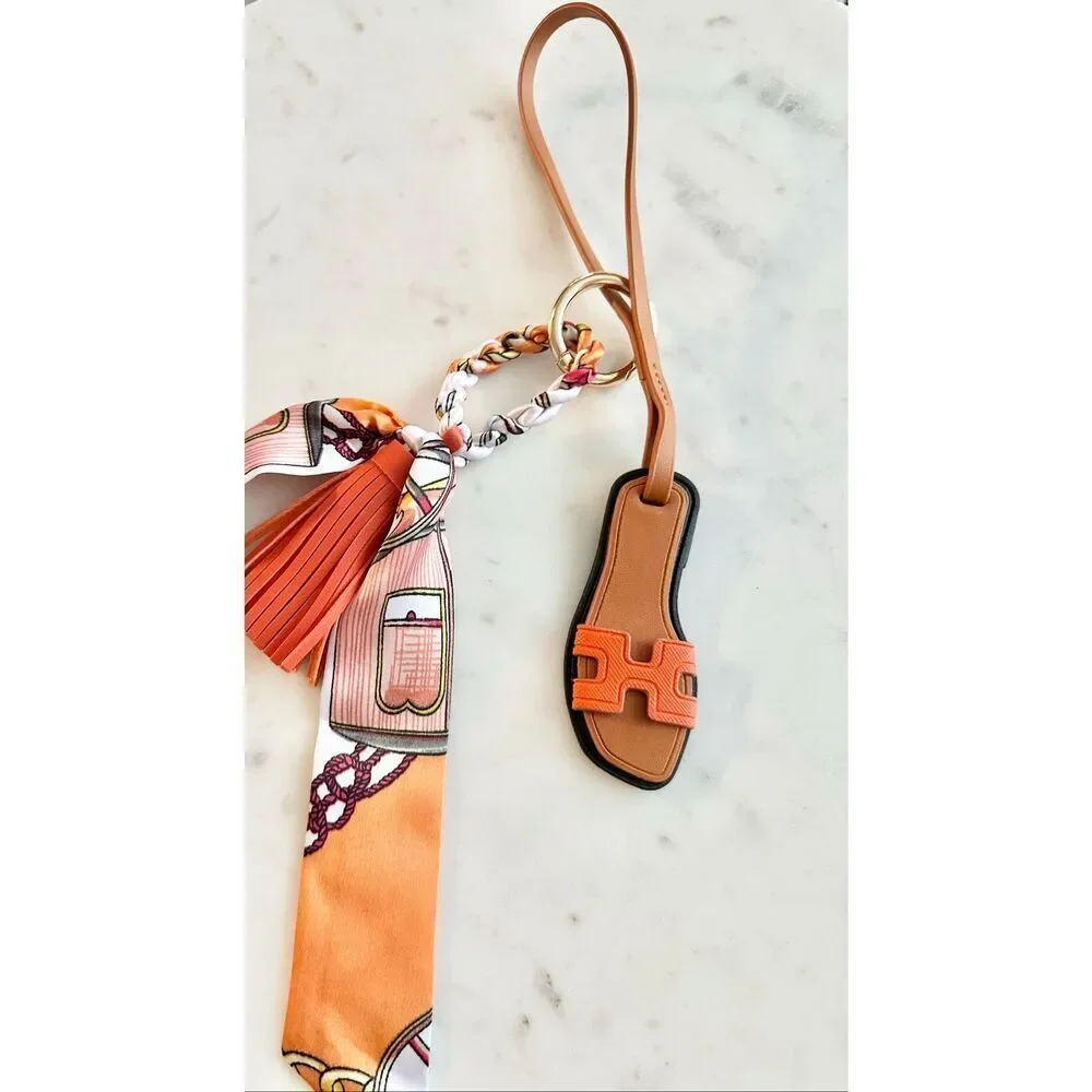 Bright orange purse charm flip-flop and pattern scarf